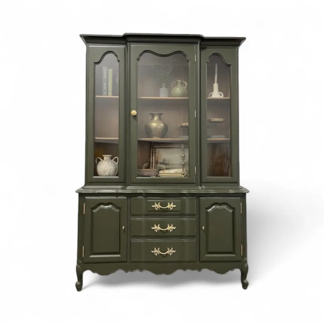 Dark green vintage china cabinet with drawers.