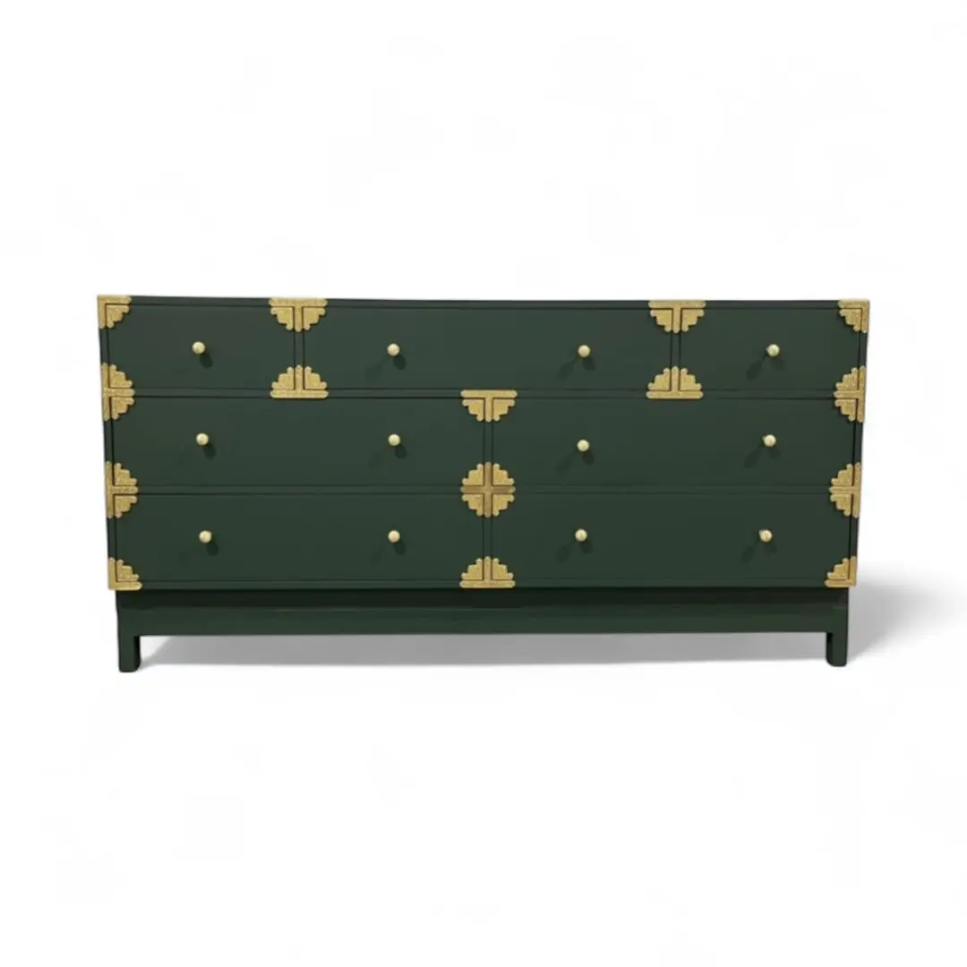 Green dresser with gold geometric accents.