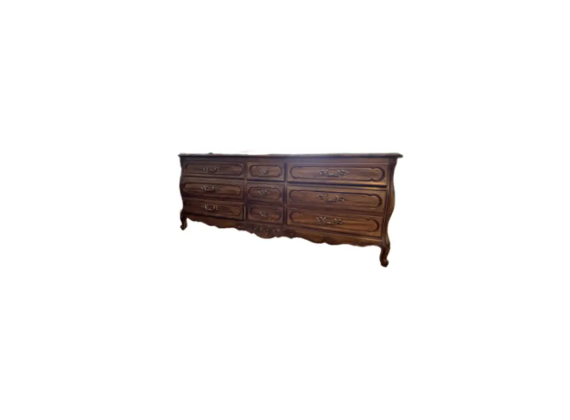 A large wooden dresser with six drawers.