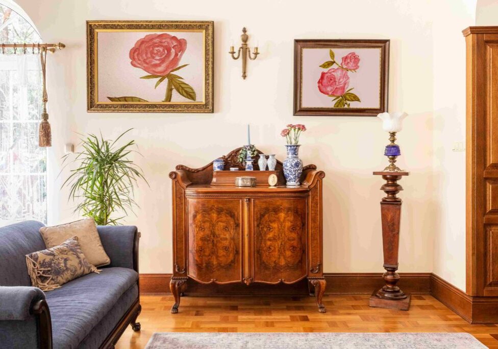 Elegant living room with vintage wooden furniture.